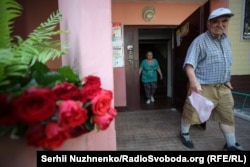 Residents and other mourners placed flowers outside Babchenko's apartment building in Kyiv.