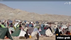 A makeshift refugee camp where thousands of families driven from their homes by a devastating drought live outside the city of Herat.