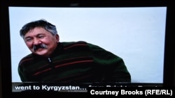 A Kyrgyz immigrant in the exhibit's video installation describes his move from his home country to New York.