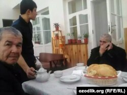 Muhammad Bekjon (right) makes a phone call after his release from prison.