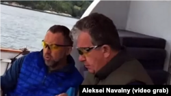Oleg Deripaska (left) and Sergei Prikhodko are shown allegedly on board the business tycoon's yacht in the video.