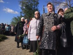 Ceremonia de reînhumare a victimelor represiunilor staliniste