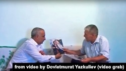 Turkmen video producer Dovletmurat Yazkuliev (left) with a man he claims is the father of jailed activist Omurzak Omarkuliev