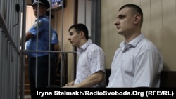 Former Berkut officers Serhiy Zinchenko (left) and Pavlo Abroskin appear in court in Kyiv in August 2015. Neither appears likely to face trial in Ukraine now.