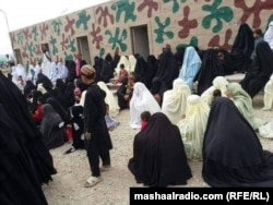 Women and children too wait for hours