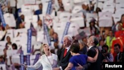 U.S. Democratic presidential nominee Hillary Clinton with husband Bill and running mate Tim Kaine at the Democratic National Convention.