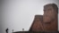 Nagorno-Karabakh - A man walks towards the iconic statue "We Are Our Mountains" outside Stepanakert on November 12, 2020.