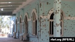 Bullet holes are seen on the wall of a mosque at an A mosque inside the Afghan military base where Taliban assailants killed scores of soldiers on April 21.