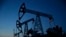 Pump jacks are seen at LUKoil's Imilorskoye oil field. Falling oil prices and revenues are endangering Russia's credit rating.