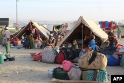 Afghan refugees wait in tents at a makeshift shelter camp in Chaman, a Pakistani town on the border with Afghanistan, after the Taliban came to power in August 2021.