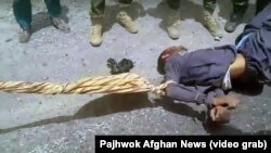 The two-minute footage was posted this week by the Pajhwok news agency and shows a group of men, including some in Afghan police and army uniforms, beating and kicking the man and dragging him behind a marked police vehicle.