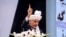 Afghan President Ashraf Ghani gestures as he speaks during the last day of the Loya Jirga or grand assembly in Kabul on August 9.