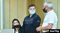 Azerbaijan - Armenian prisoner Viken Euljekian (center) stands trial in Baku, June 8, 2021.
