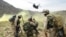 FILE: U.S. soldiers prepare to board a helicopter after Operation Deliberate Strike some 60 kilometers north of Kandahar.
