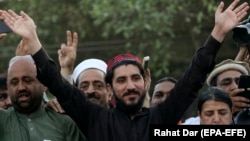 FILE: Manzoor Rashteen, leader of the Pashtun Tahafuz (Protection) Movement (PTM) waves to supporters during a demonstration in Lahore in April 2018.