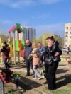Mourners Leave Flowers, Toys For Victims Of Russian Strike In Kryviy Rih