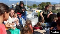 Armenia - Refugees from Nagorno-Karabakh region sit in the back of a truck upon their arrival in the border village of Kornidzor, , September 27, 2023.