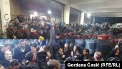 Protesters rally in front of the building of public broadcaster Radio Television of Serbia during protests in Belgrade on March 16.