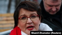 Yulia Galyamina speaks with reporters outside a court building before a hearing in Moscow on December 23, 2020.