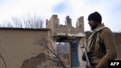 A Pakistani soldier stands near a damaged Taliban militant training center in South Waziristan in December.