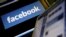 Компьютер мониторындағы Facebook әлеуметтік желісінің белгі-жазуы.