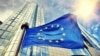 GENERIC STOCK PHOTO - illustration - EU flag waving in front of European Parliament building. Brussels - generic