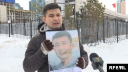 Baibolat Kunbolatuly protests in front of the Chinese Embassy in Nur-Sultan in February 2020. “I think about what would happen to my children if I were to die [in prison]," he says. 