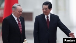 Kazakh President Nursultan Nazarbaev (left) visited his Chinese counterpart Hu Jintao in Beijing in February.