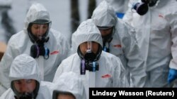 Вашингтонду дезинфекциялап жүргөн кызматкерлер. 13-март, 2020-жыл.