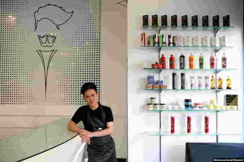 Hairdresser Hussain, 19, at a hair salon in Kabul. "I am optimistic about the Taliban joining the peace process." Like many young Afghans, Hussain&nbsp;grew up in neighbouring Iran where millions have taken refuge. "I want the Taliban to change their policy and not behave like before."