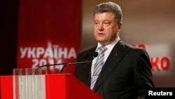 Ukrainian businessman, politician, and presidential candidate Petro Poroshenko declared victory in front of supporters at his election headquarters in Kyiv on May 25.