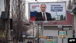 Campaign billboards of Russian President Vladimir Putin reading "Simferopol for the Strong Russia! Vladimir Putin" in Simferopol, Crimea on March 9.