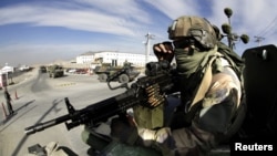 A French gunner secures a convoy leaving the forward operational base of Nijrab following a handover with the Afghan army as part of the withdrawal of French troops. (file photo)