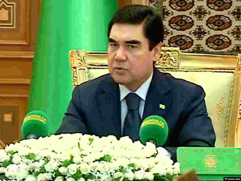 Berdymukhammedov at a cabinet meeting. The Turkmen president&nbsp;is frequently shown against a foreground of white roses, and is even the subject of an adulatory poem entitled "White Roses."