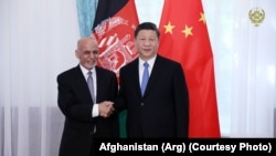 FILE: Afghan President Ashraf Ghani with his Chinese counterpart Xi Jinping in Kyrgyzstan in June 2019.
