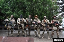 Байцы ПВК «Вагнэр» у цэнтры Растова-на-Доне.
