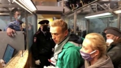 'I Am Not Afraid': Defiant Navalny Detained At Moscow Airport
