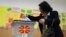A woman votes during the presidential election in Skopje, North Macedonia, on April 24.