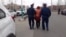 Kazakhstan - Police officers are detaining Akhzhan Nogayeva who has performed in front of the city administration building. 1 April 2020