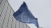 The flag of the International Atomic Energy Agency flies in front of its headquarters during an IAEA Board of Governors meeting in Vienna, Austria, Feburary 2023
