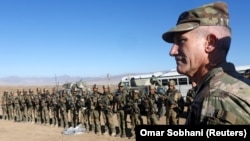 U.S. Army General John Nicholson, the commander of Resolute Support forces and U.S. forces in Afghanistan, speaks with Afghan police special forces in the southeastern Logar province on November 30.