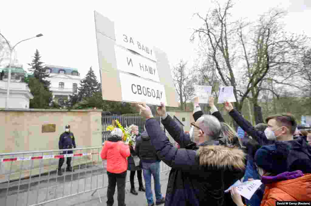 Czechs protested the news of the alleged Russian involvement in the 2014 arms depot blast outside the Russian Embassy in Prague on April 18. The sign reads: "For Your And Our Freedom."