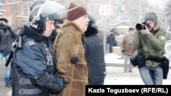 Kazakh police arrest people protesting in the country's main city, Almaty, over the events in Zhanaozen on December 17.