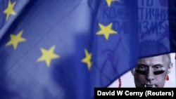 Зображення російського президента Володимира Путіна під час акції протесту у столиці Чехії проти збройної агресії Росії у Криму. Прага, 8 березня 2014 року 