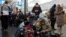 People take shelter inside the metro station during Russian missile attacks in Kyiv