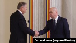 Klaus Iohannis și Ilie Bolojan.