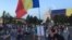 Scores of protesters show up on August 14 outside the government building in Bucharest, calling for the resignation of Prime Minister Viorica Dancila's cabinet.