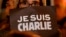 Плакат с надписью: "Je suis Charlie" ("Шарли - это я) - в руках участника акции в Ницце. 7 января 2015 года.