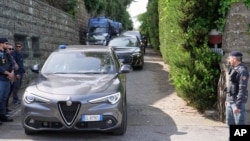 Iranian delegates leave the Omani Embassy in Rome following talks with US officials.