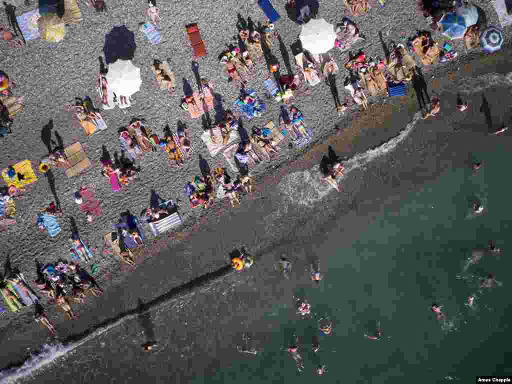 Tourists bask in Gagra. Some 70 percent of Abkhazia's budget comes from Russian aid, and most of the rest comes from tourism.